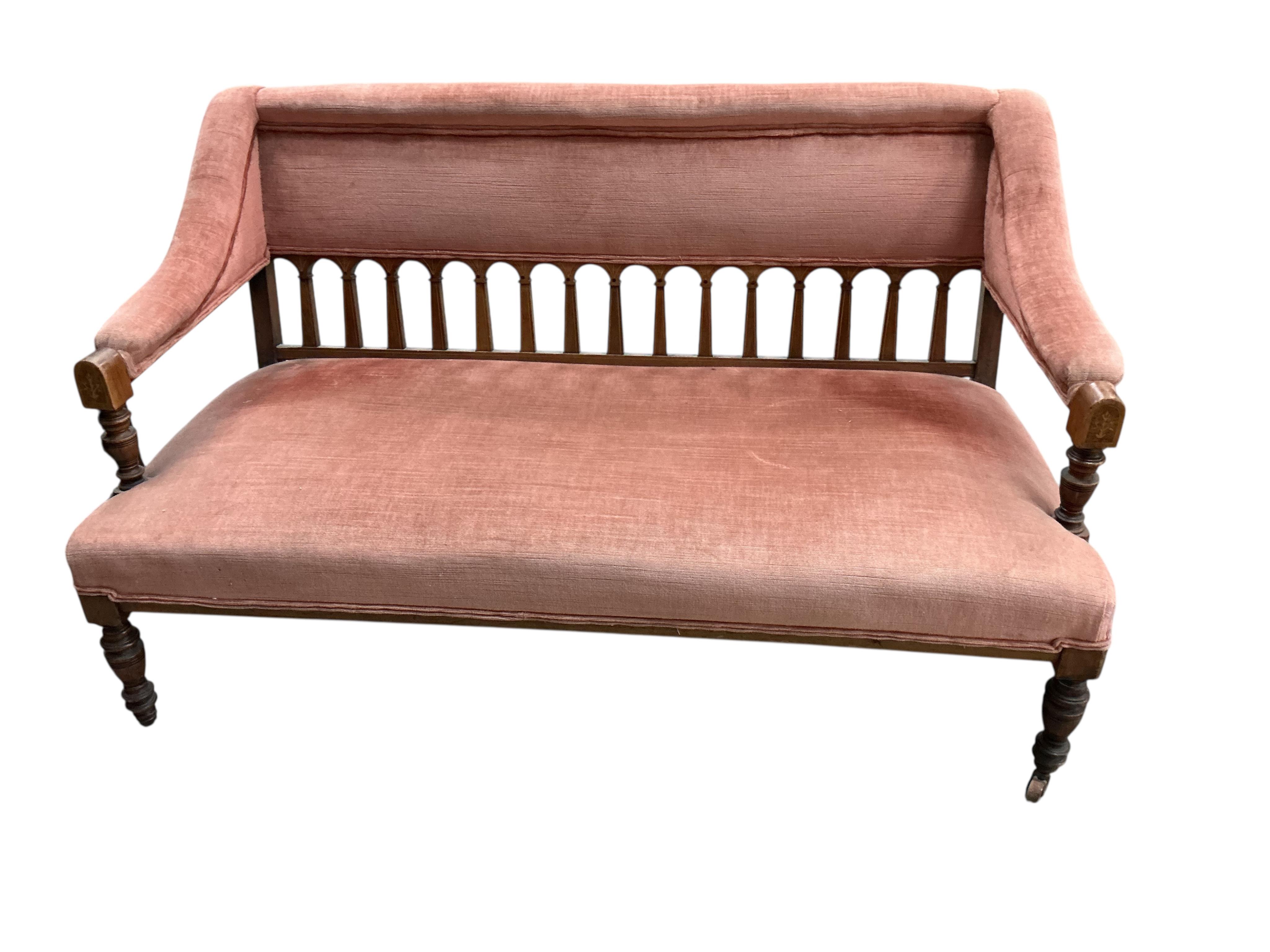 A late Victorian mahogany settee, width 128cm, depth 60cm, height 78cm.